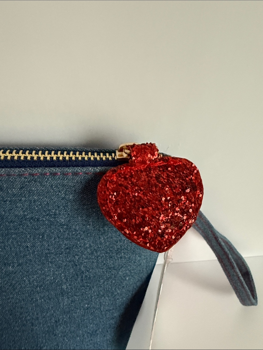 Blue denim pouch featuring embroidered Hello Kitty patches and a red satin bow - Picture 5 of 6